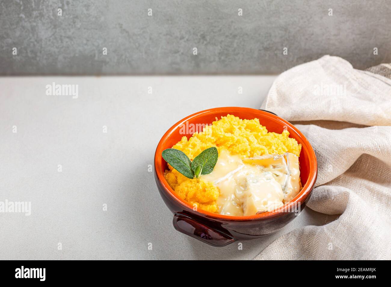 Dish of polenta with melted cheese Stock Photo Alamy