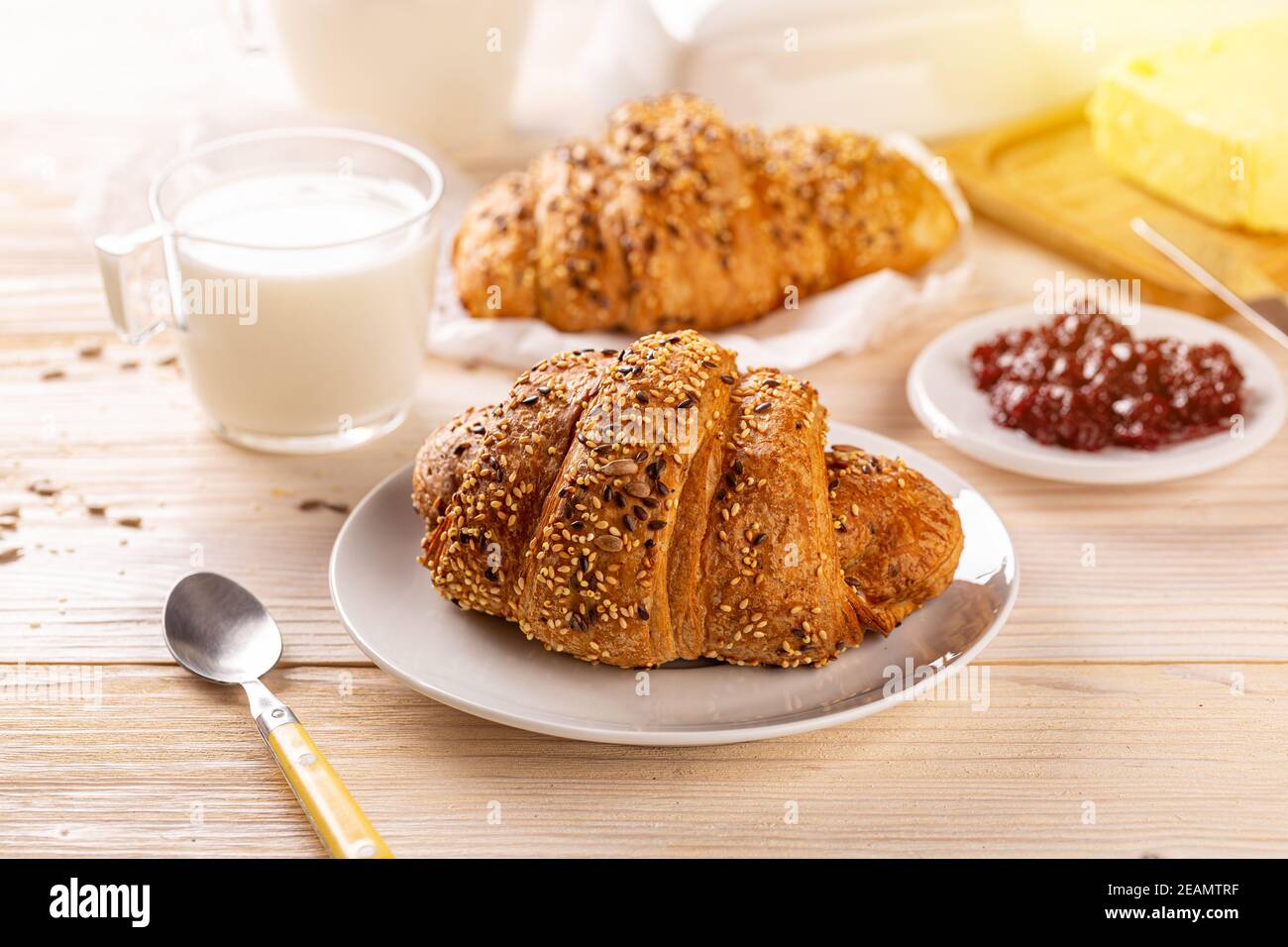 Multigrain croissant sprinkled with seeds Stock Photo