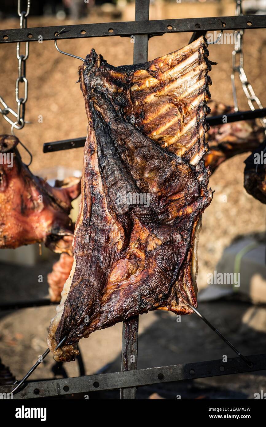 Hanging ribs over the bbq Stock Photo