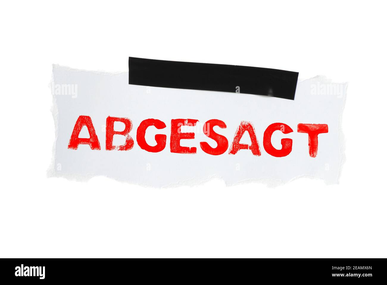 Cancelled in german language on white paper with adhesive tape Stock