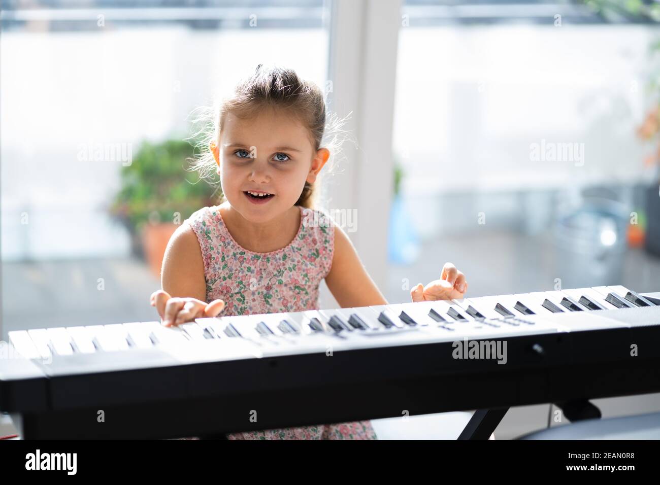 Child Girl Playing Music Keyboard Piano Stock Photo
