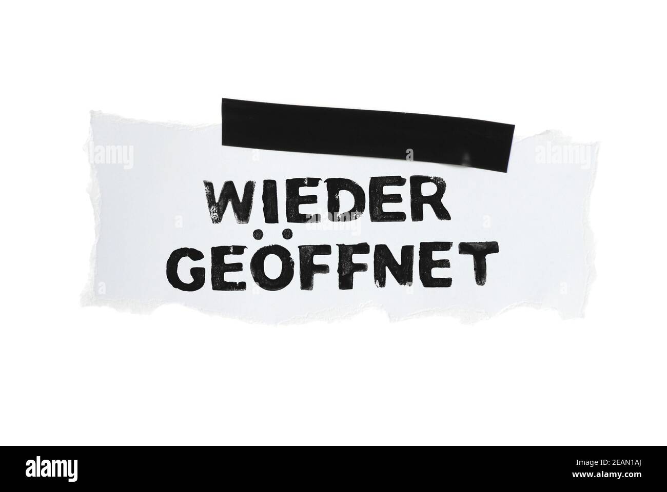 Reopening in german language on white paper with black tape Stock Photo