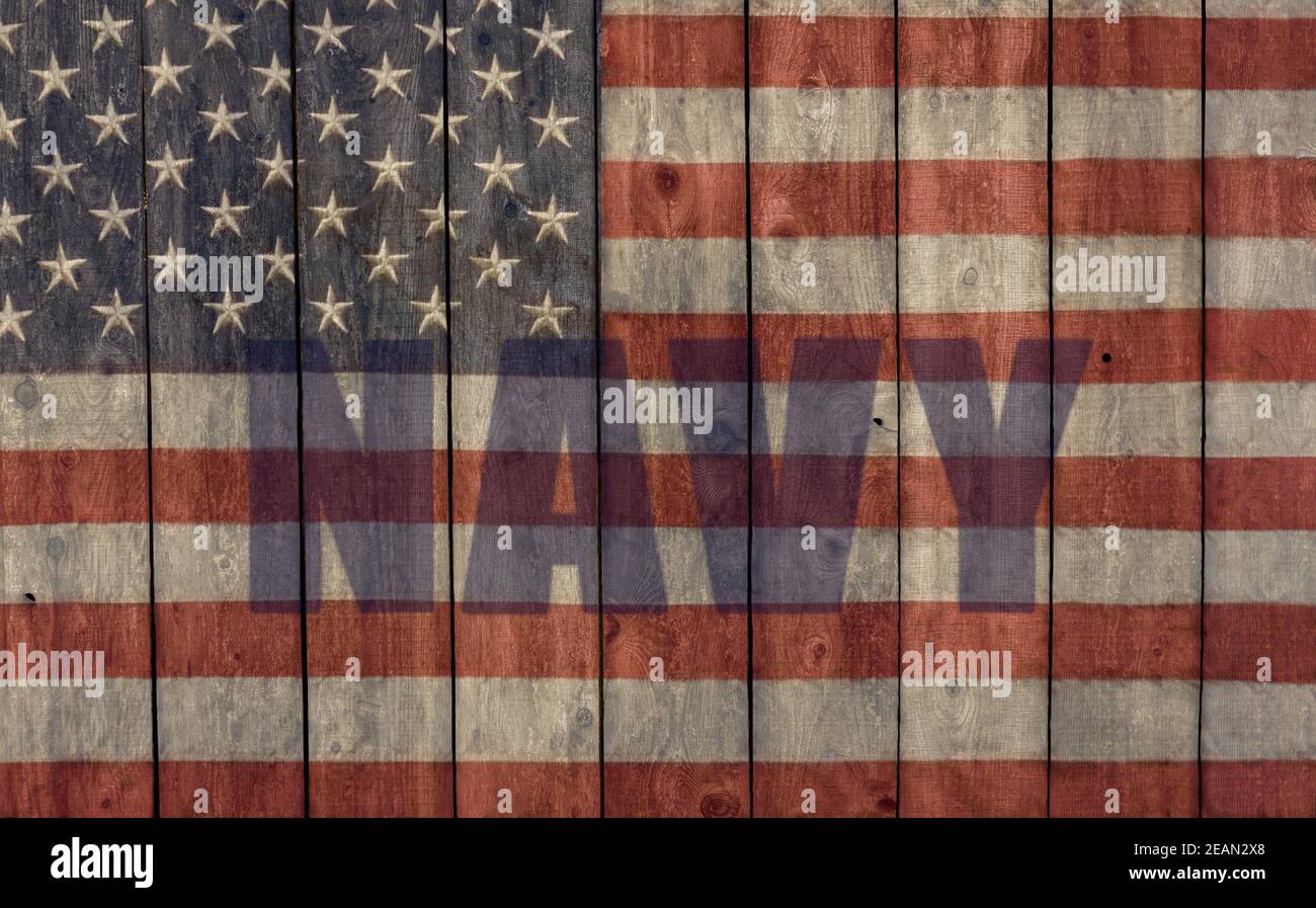 vintage American flag and navy logo painted on the side of a rustic weathered barn Stock Photo