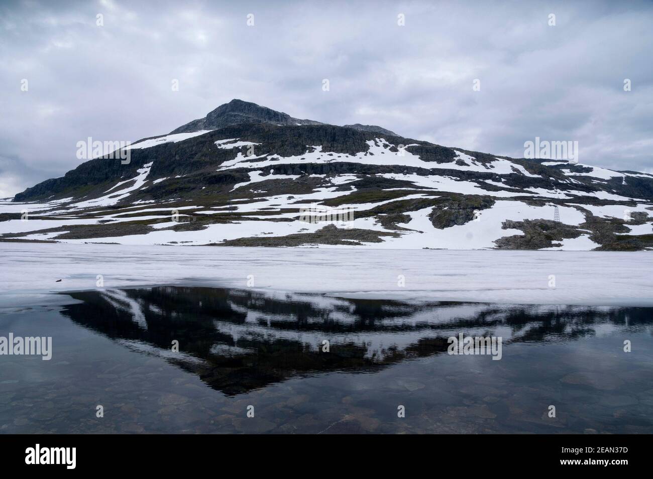 Mountain top reflecting in a lake Stock Photo