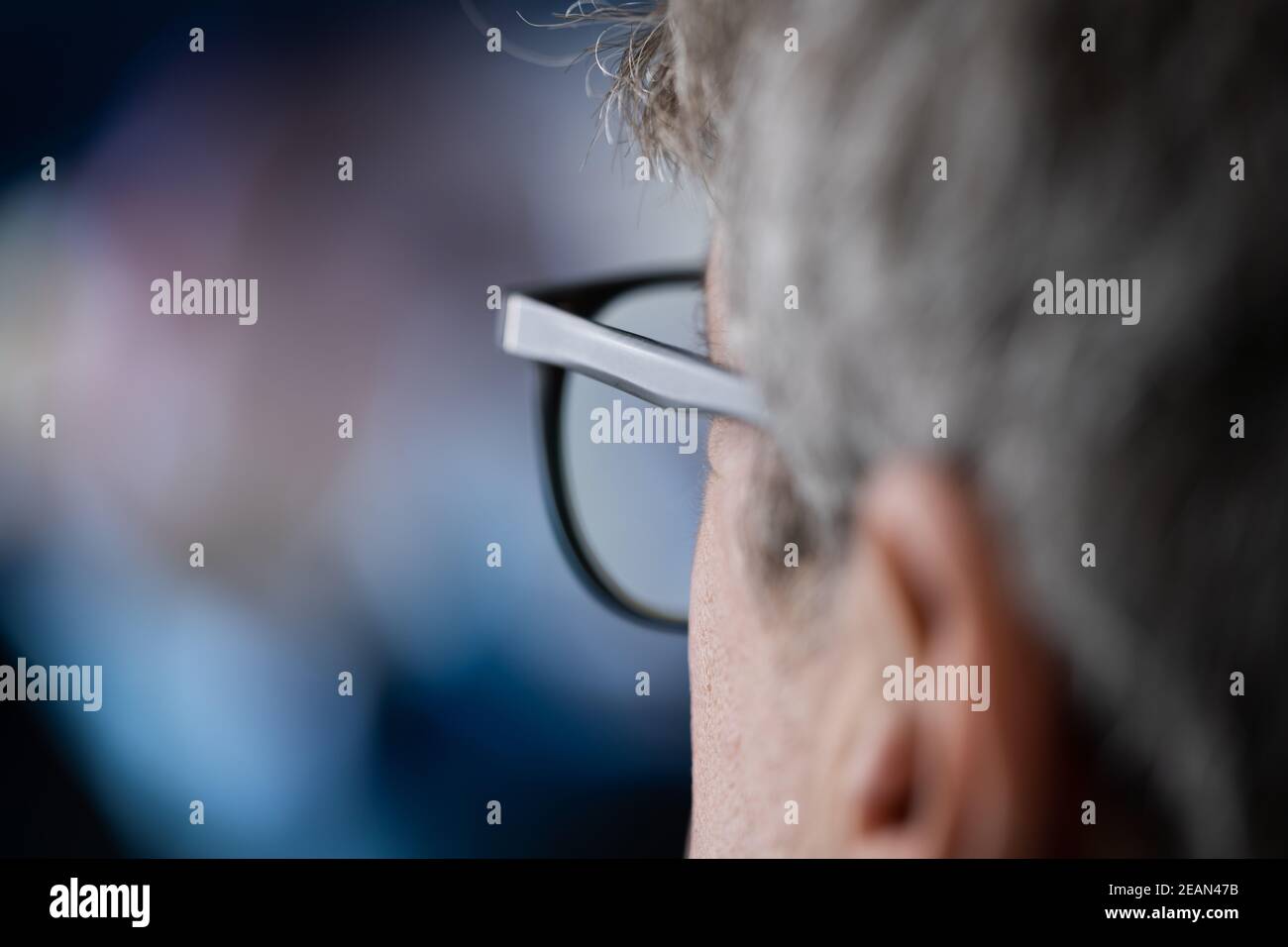 Man Watching TV Movie Or Television Stock Photo