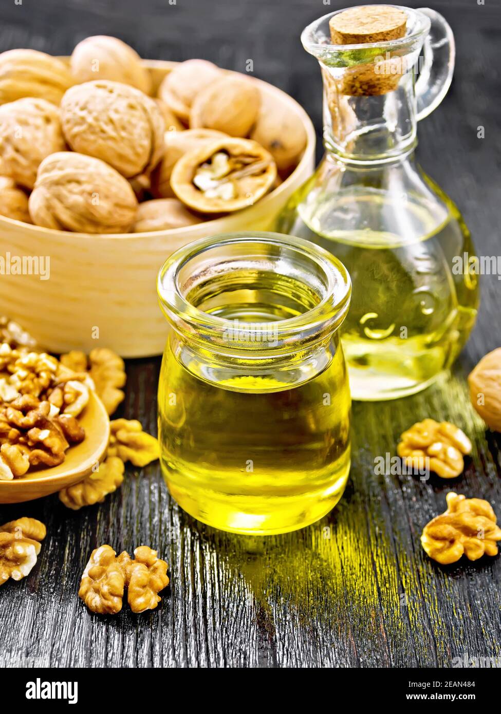 Oil walnut in jar and decanter on black board Stock Photo Alamy