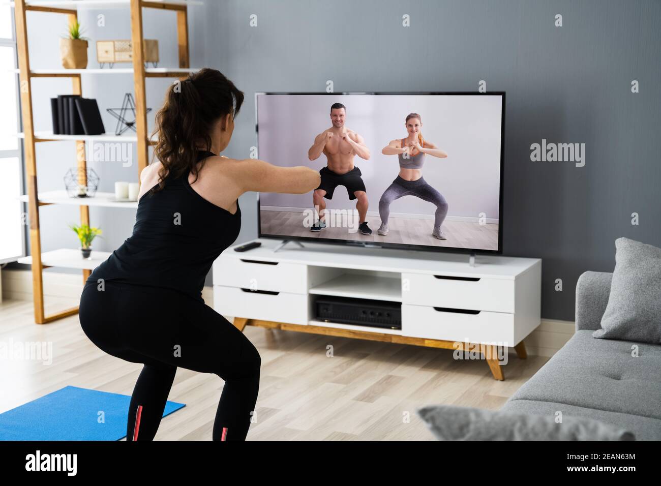 Online TV Home Fitness Workout Stock Photo