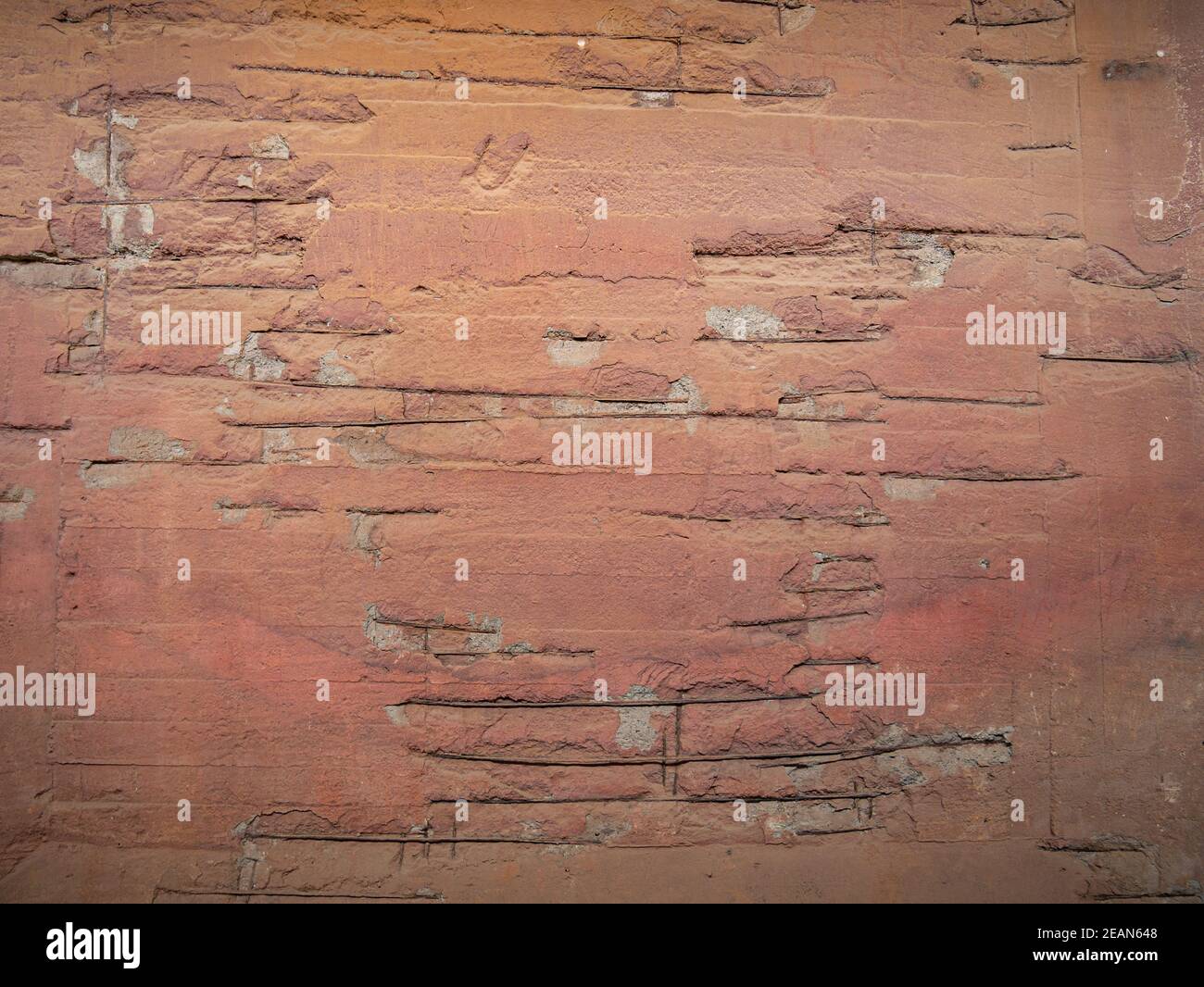 Reinforcement bars in a painted concrete wall Stock Photo