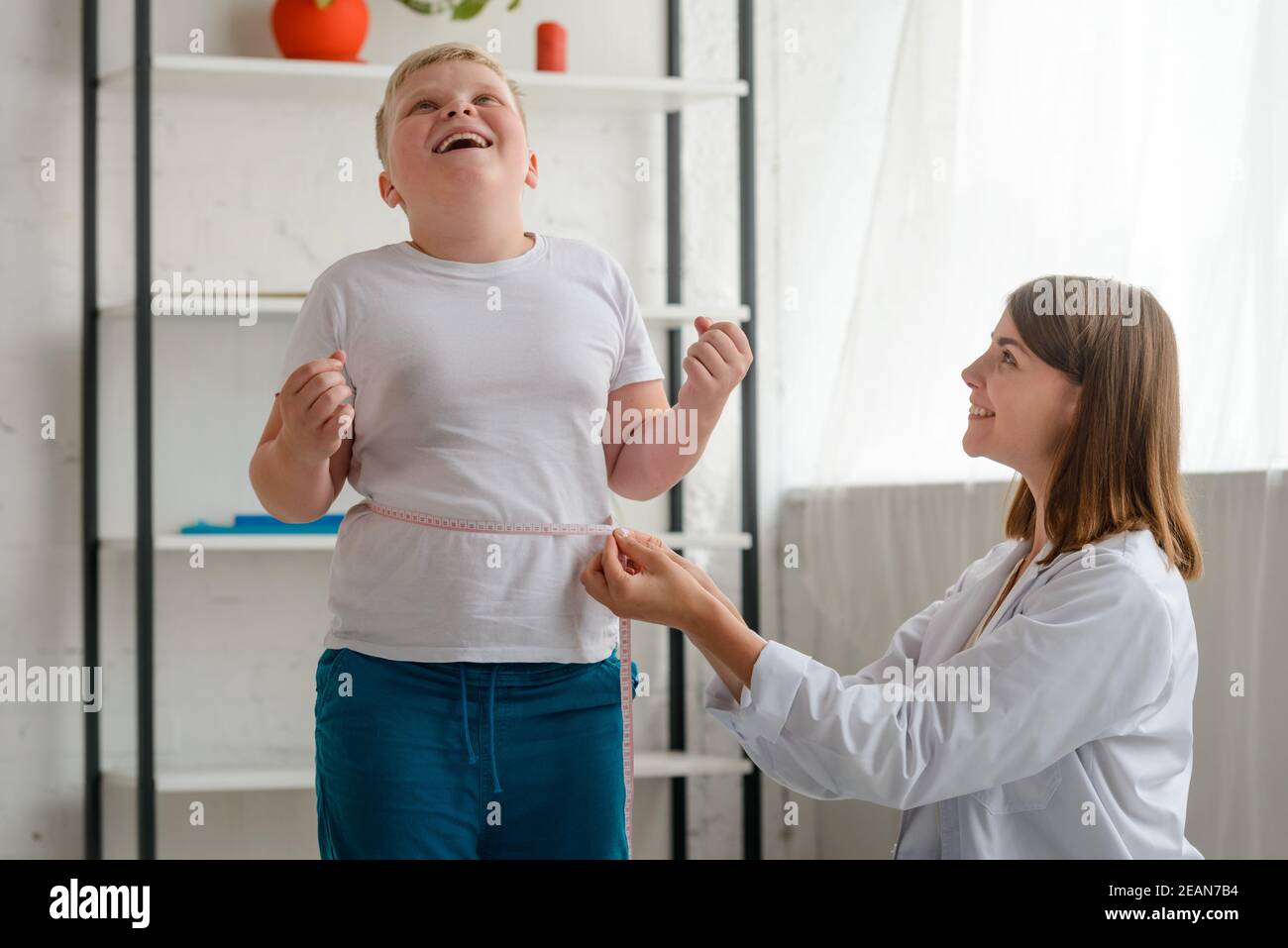 Boy's happy about results of weight loss Stock Photo