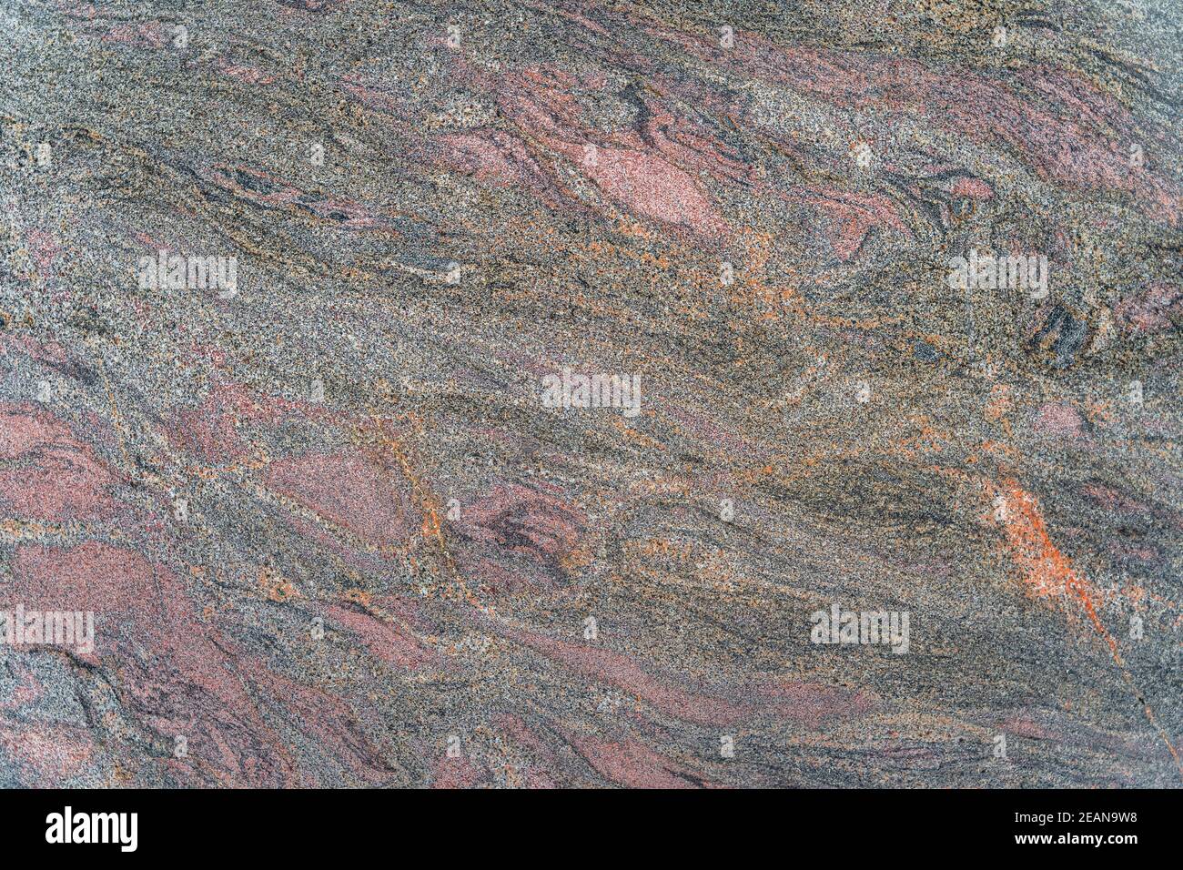Dark grainy marble with multicoloured wave patterns Stock Photo
