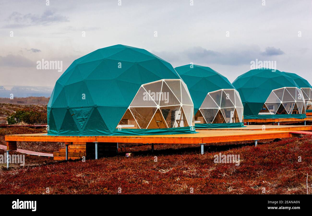 Green geo-dome tent on Kamchatka. Cozy, camping, glamping, holiday, vacation lifestyle concept. Stock Photo
