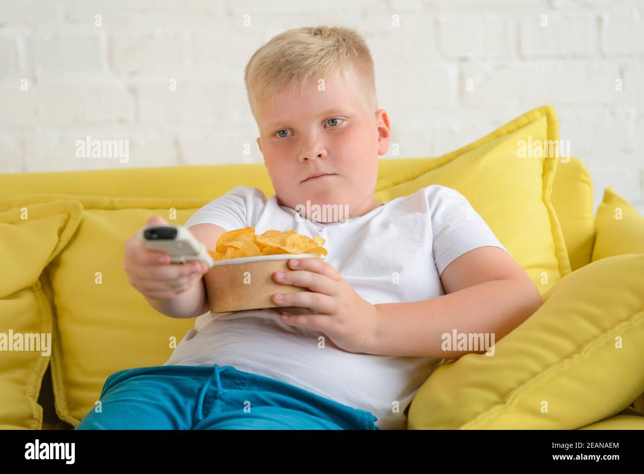 Child watch tv lazy hires stock photography and images Alamy