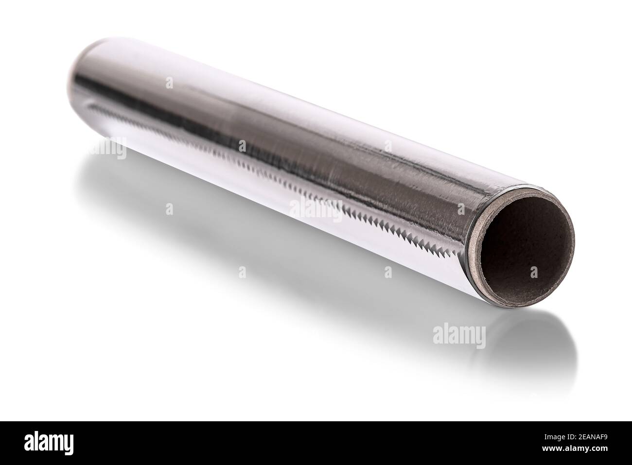 A Silver aluminium foil roll isolated on the white background. The foil is extremely pliable and can be bent or wrapped around objects with ease. Stock Photo