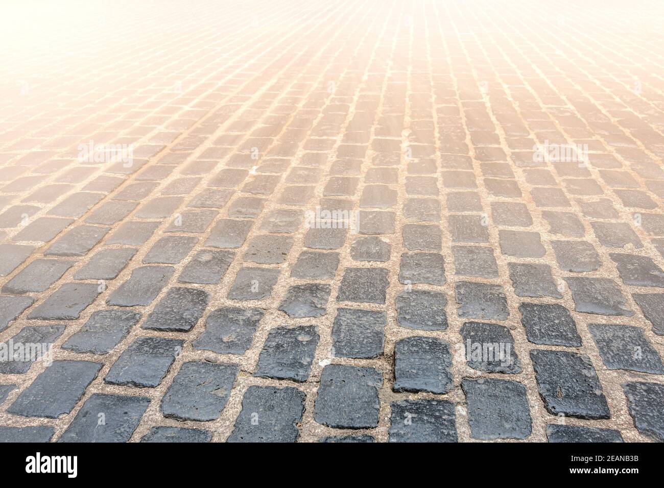 Granite cobblestoned pavement background. Selective focus Stock Photo
