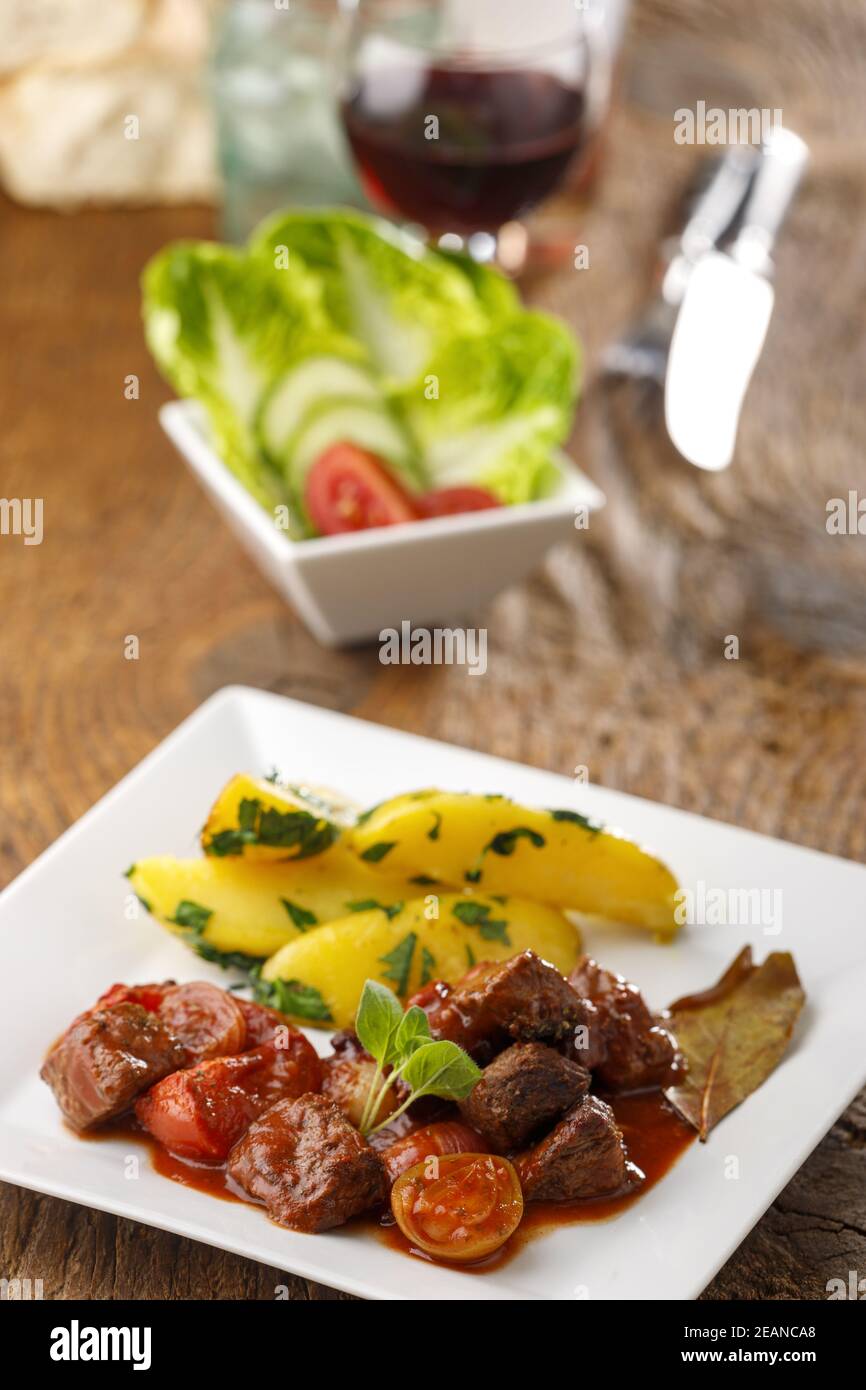 greek stifado meat stew with potatoes Stock Photo Alamy