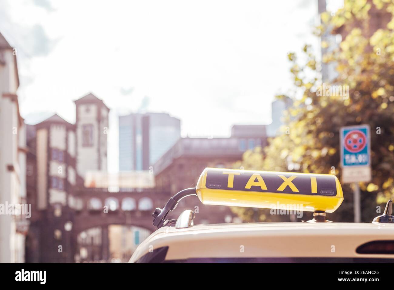taxi car with a yellow sign on the roof in the city streets Stock Photo