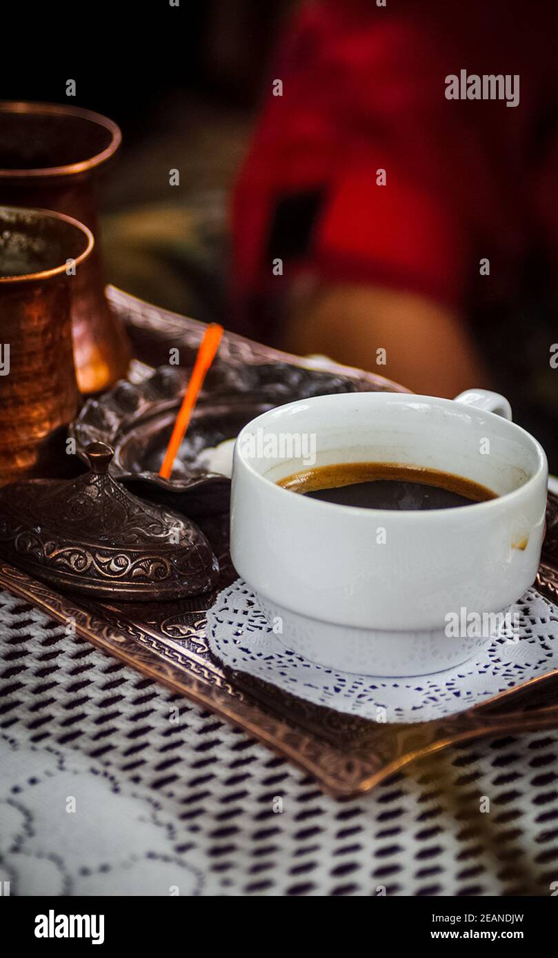 glass of coffee on the table next to the sugar bowl. Stock Photo