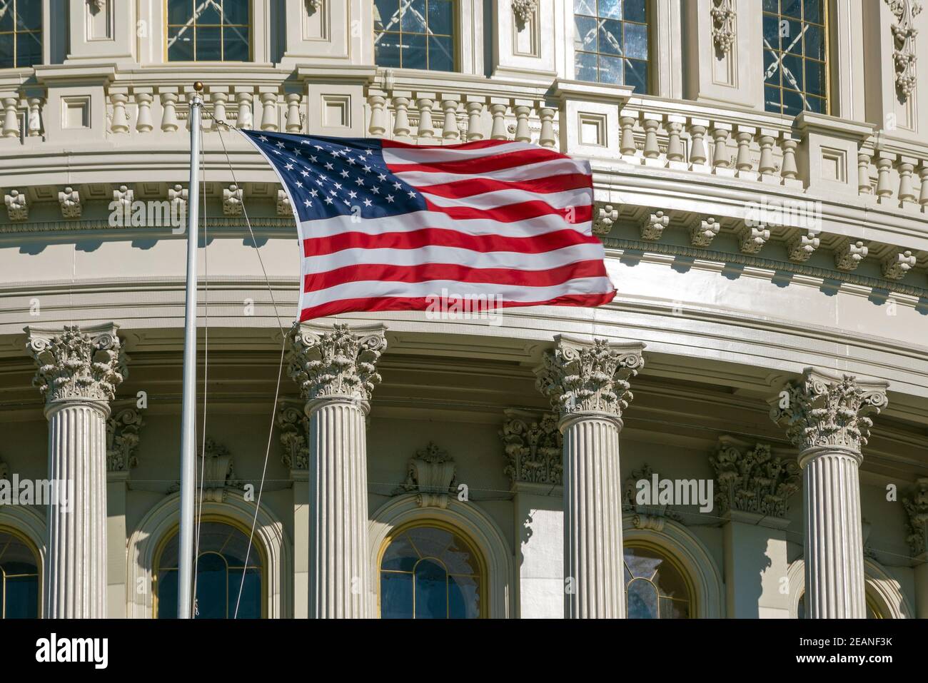 Washington DC Capitol detail with american flag Stock Photo - Alamy