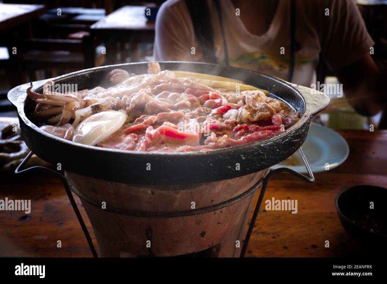 Thai Barbecue or (Moo Kratha) Buffet with Smoke. Cooking Barbecue Thai Style. Picture for Food Concept. Stock Photo