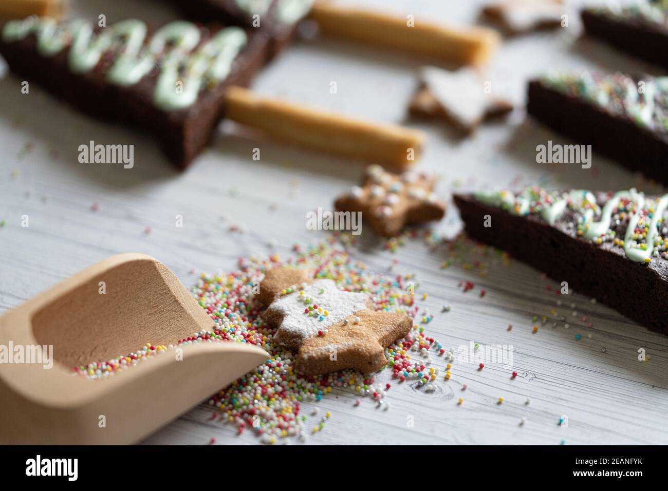 Homemade cookie in shape of Christmas tree and chocolate brownies decorated with sugar balls, Italy, Europe Stock Photo