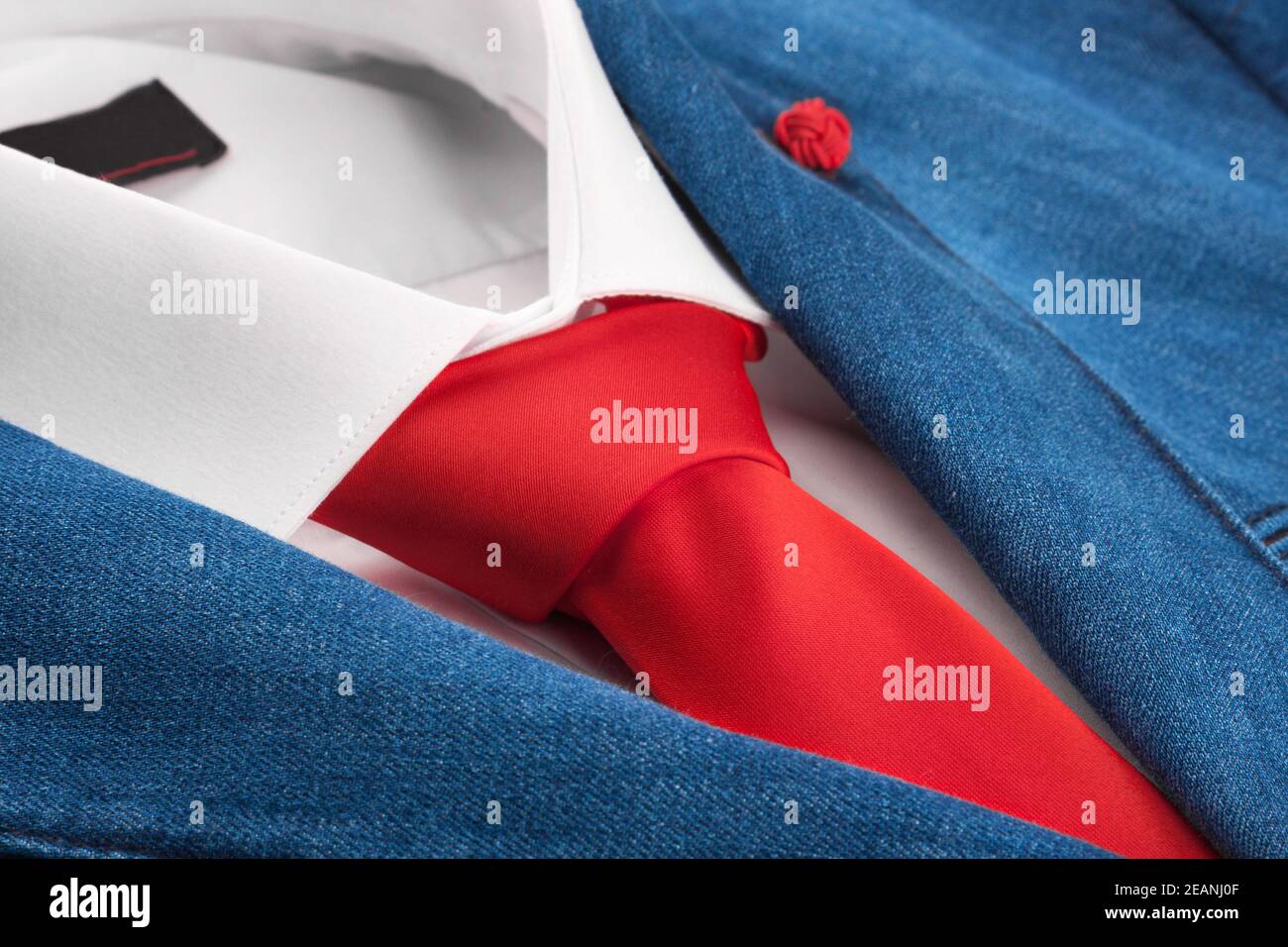 Denim jacket and red tie, men's fashion Stock Photo