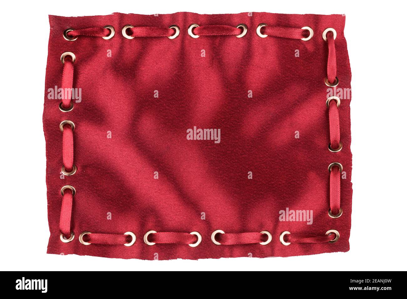 Frame made of red silk with inserted  satin ribbon in gold rings Stock Photo