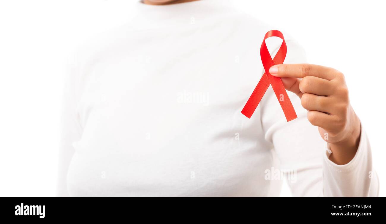 Woman holding HIV AIDS awareness red ribbon Stock Photo Alamy