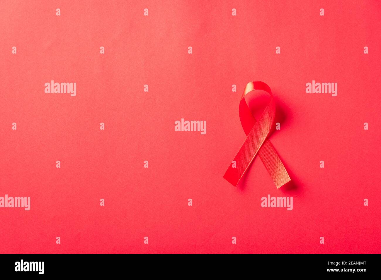 Red bow ribbon symbol HIV, AIDS cancer awareness Stock Photo