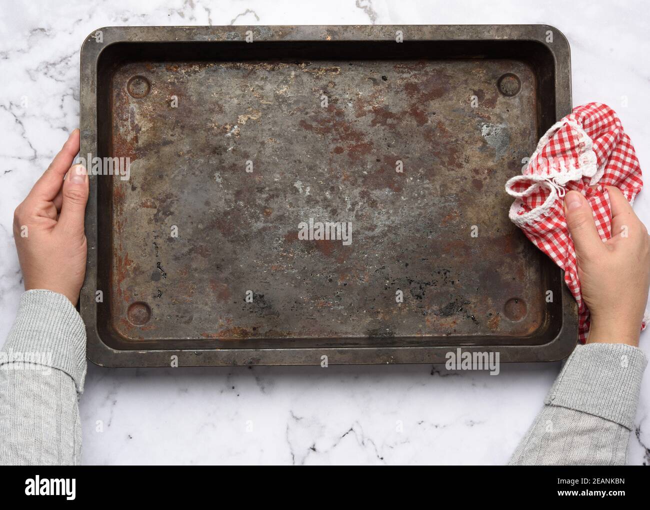 empty metal rectangular baking sheet on a white table, top view Stock Photo