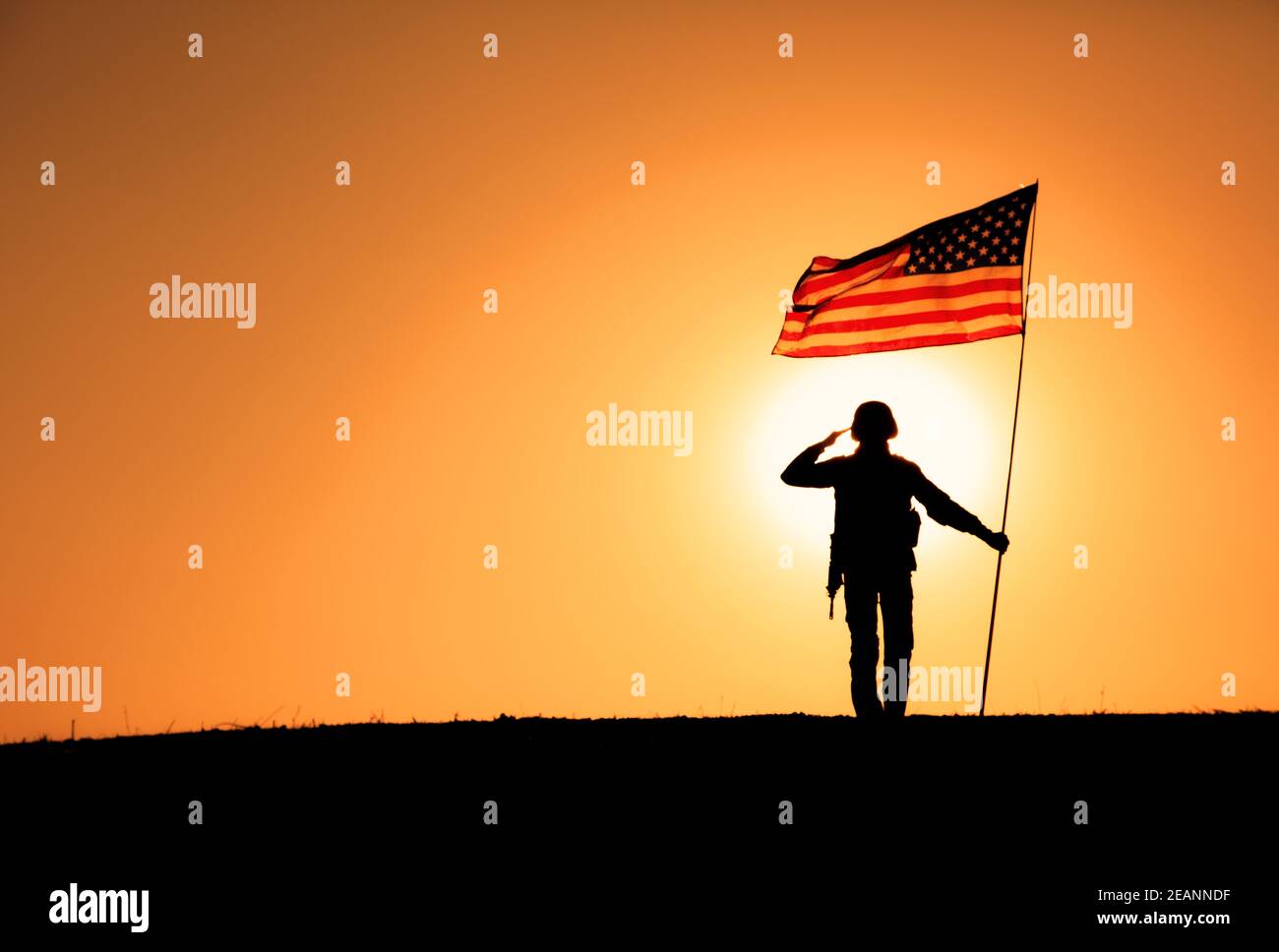 USA Soldier with flag saluting on sunset horizon Stock Photo - Alamy