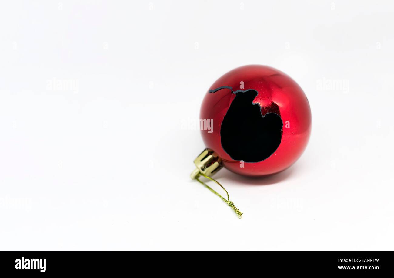 a broken red christmas ball isolated on a white background Stock Photo