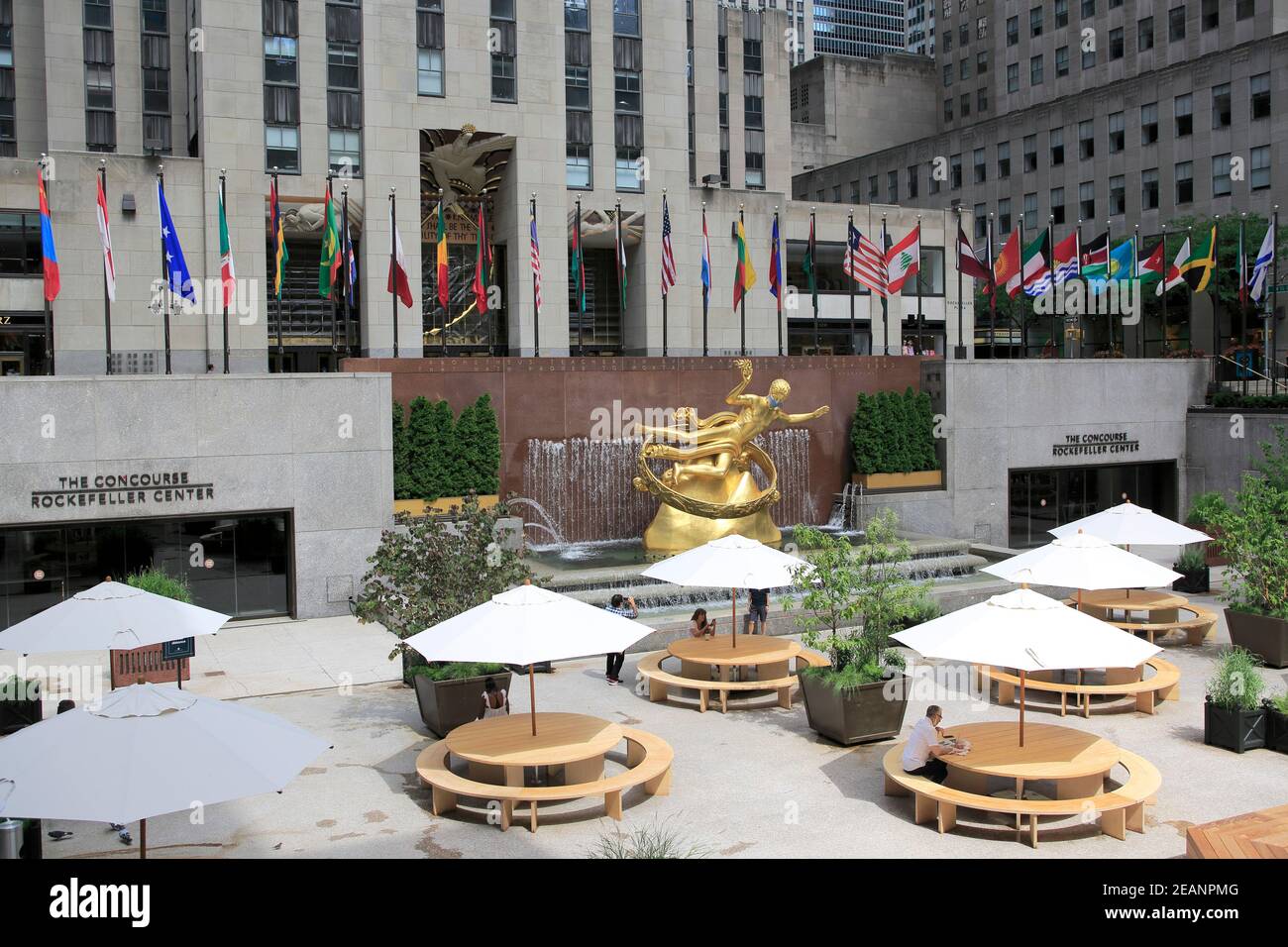 Prometheus Statue wearing mask during Coronavirus, Covid-19 Pandemic, Rockefeller Center, Plaza, Manhattan, New York City, United States of America Stock Photo