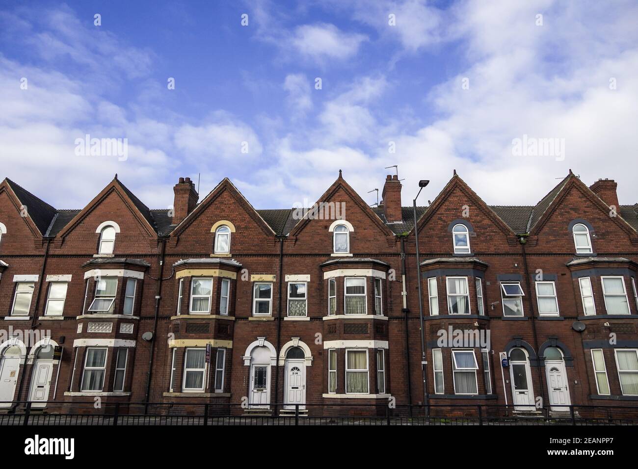 DONCASTER, UK - JANUARY 29, 2021.  A row of traditional terrace houses on a typical UK street with copy space Stock Photo