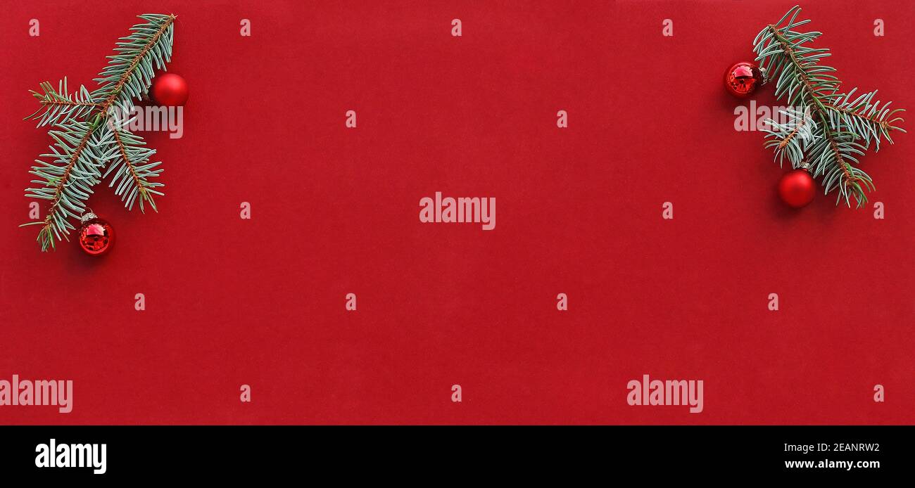 Christmas background with fir branches and Christmas tree balls in red ...