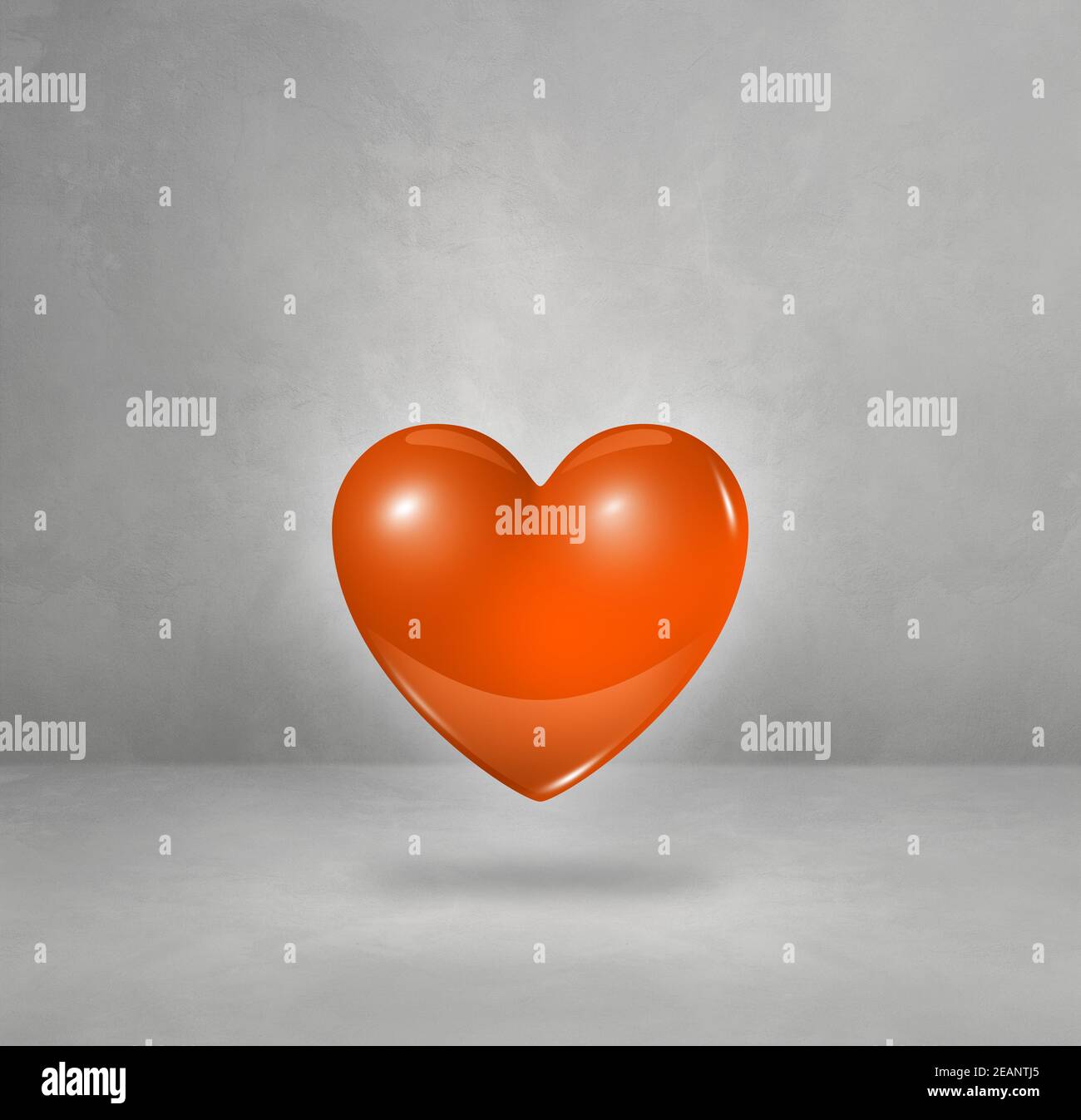 3D orange heart on a concrete studio background Stock Photo