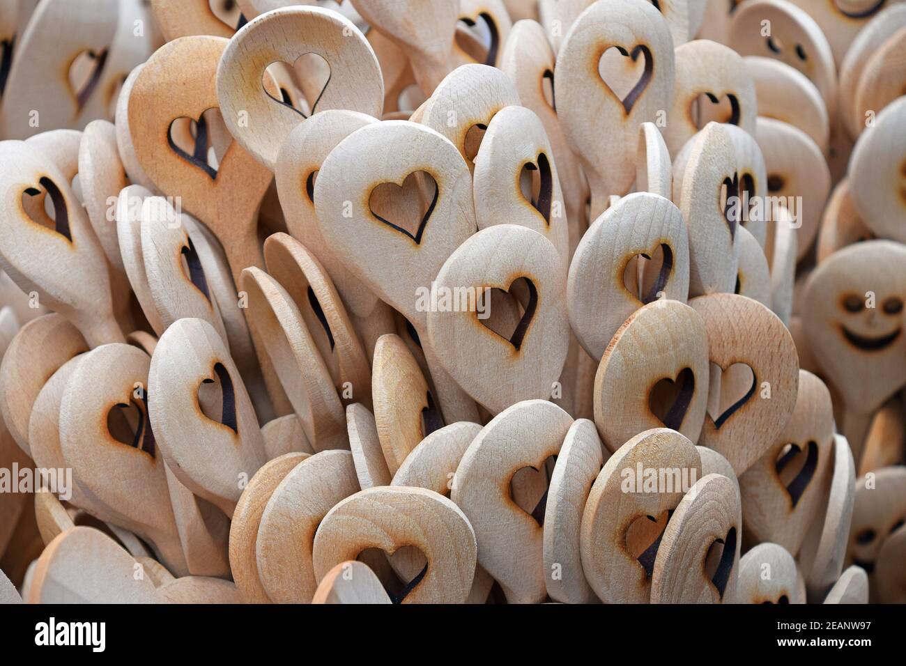 Wooden cooking spoons with heart shape carved Stock Photo