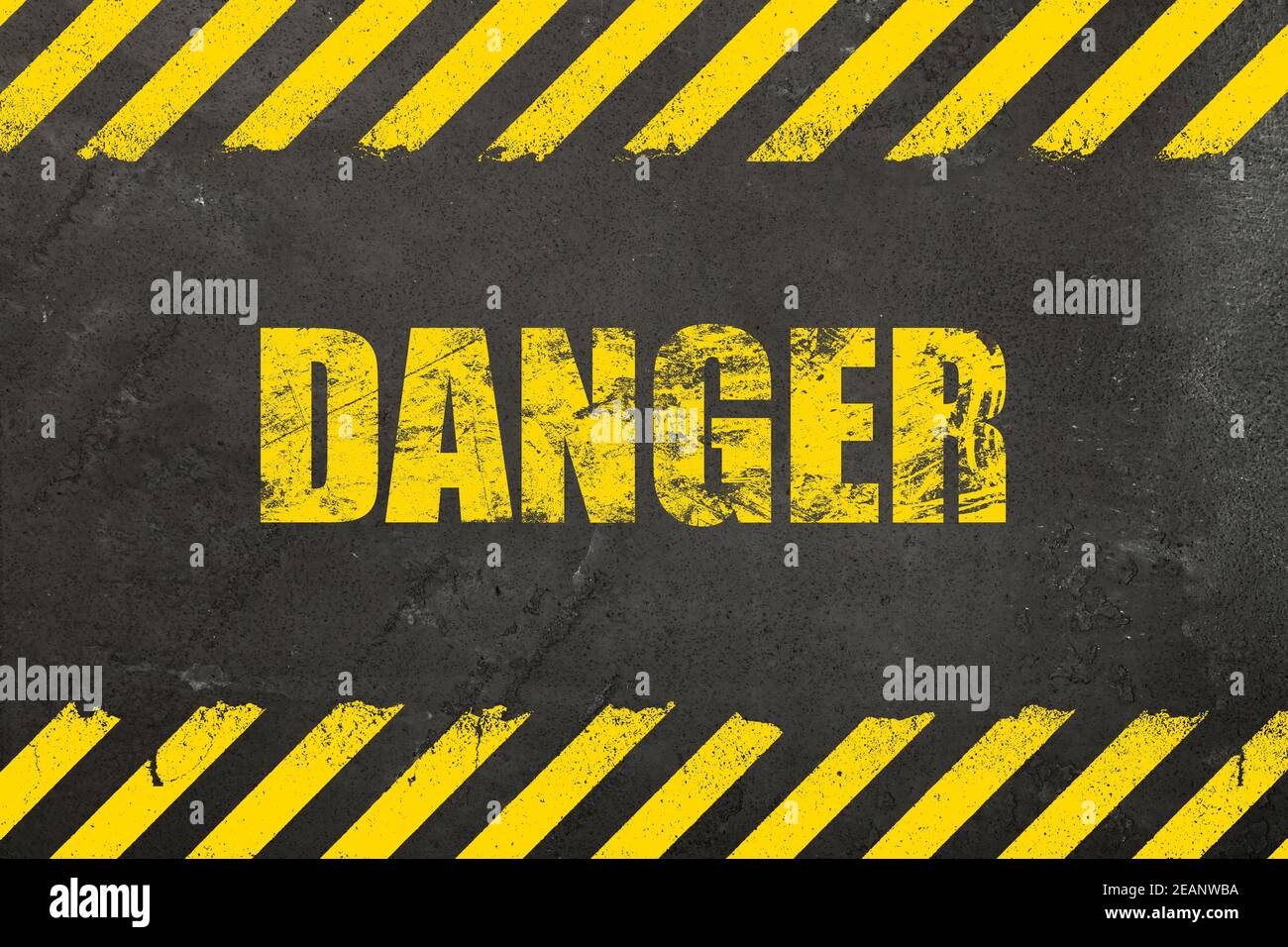 Concrete background with grunge danger sign Stock Photo