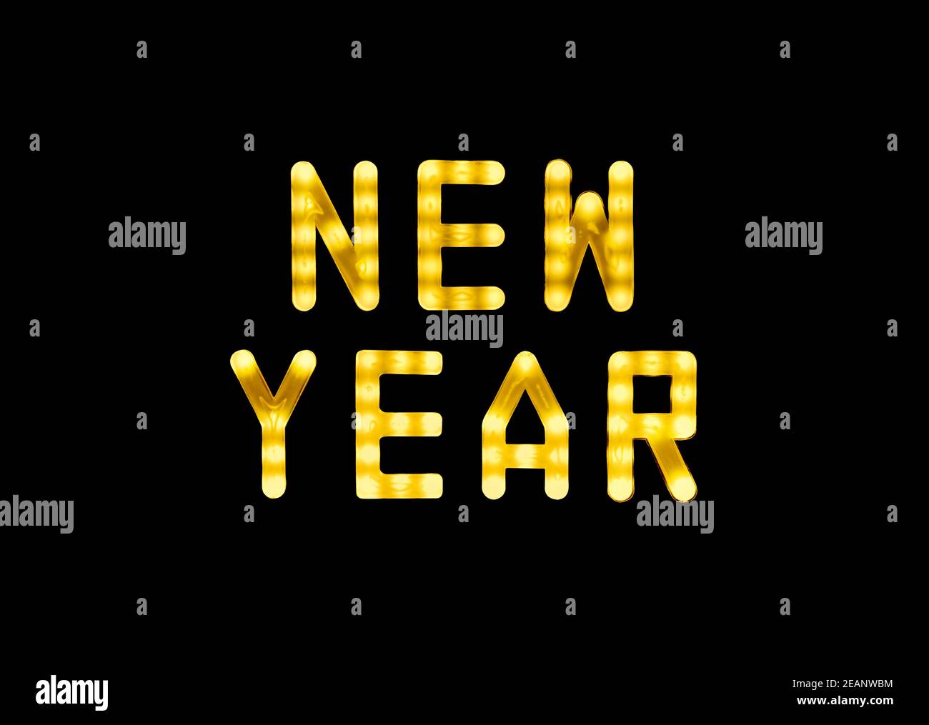 Yellow neon glowing led NEW YEAR sign on black Stock Photo