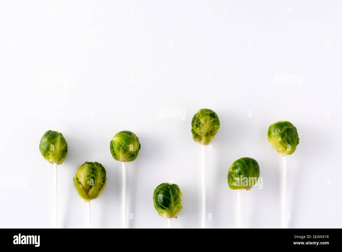 Set of brussel sprouts with lollipop sticks isolated on white background. Copy space Stock Photo