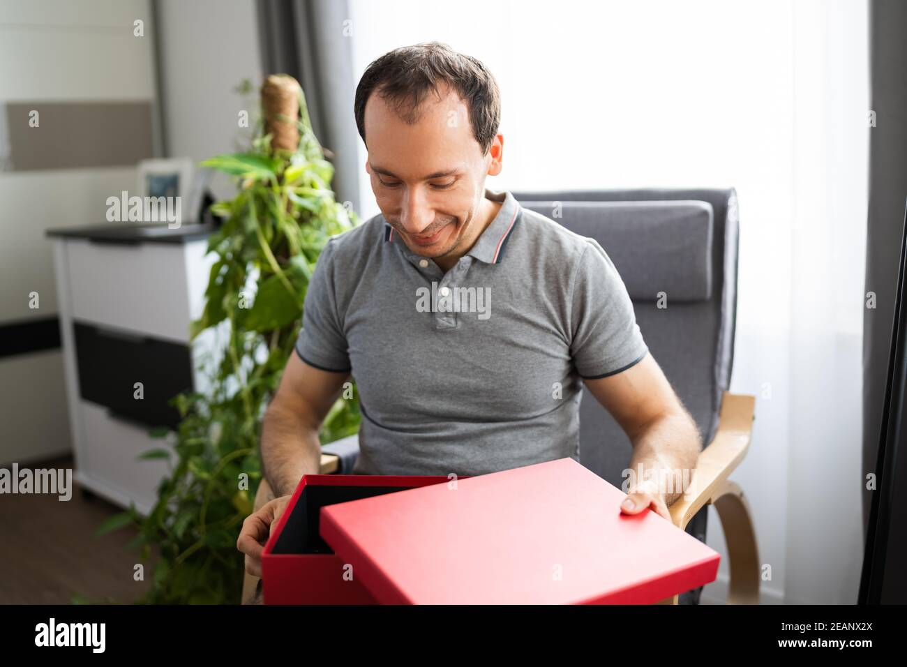 Happy Man Sitting Stock Photo