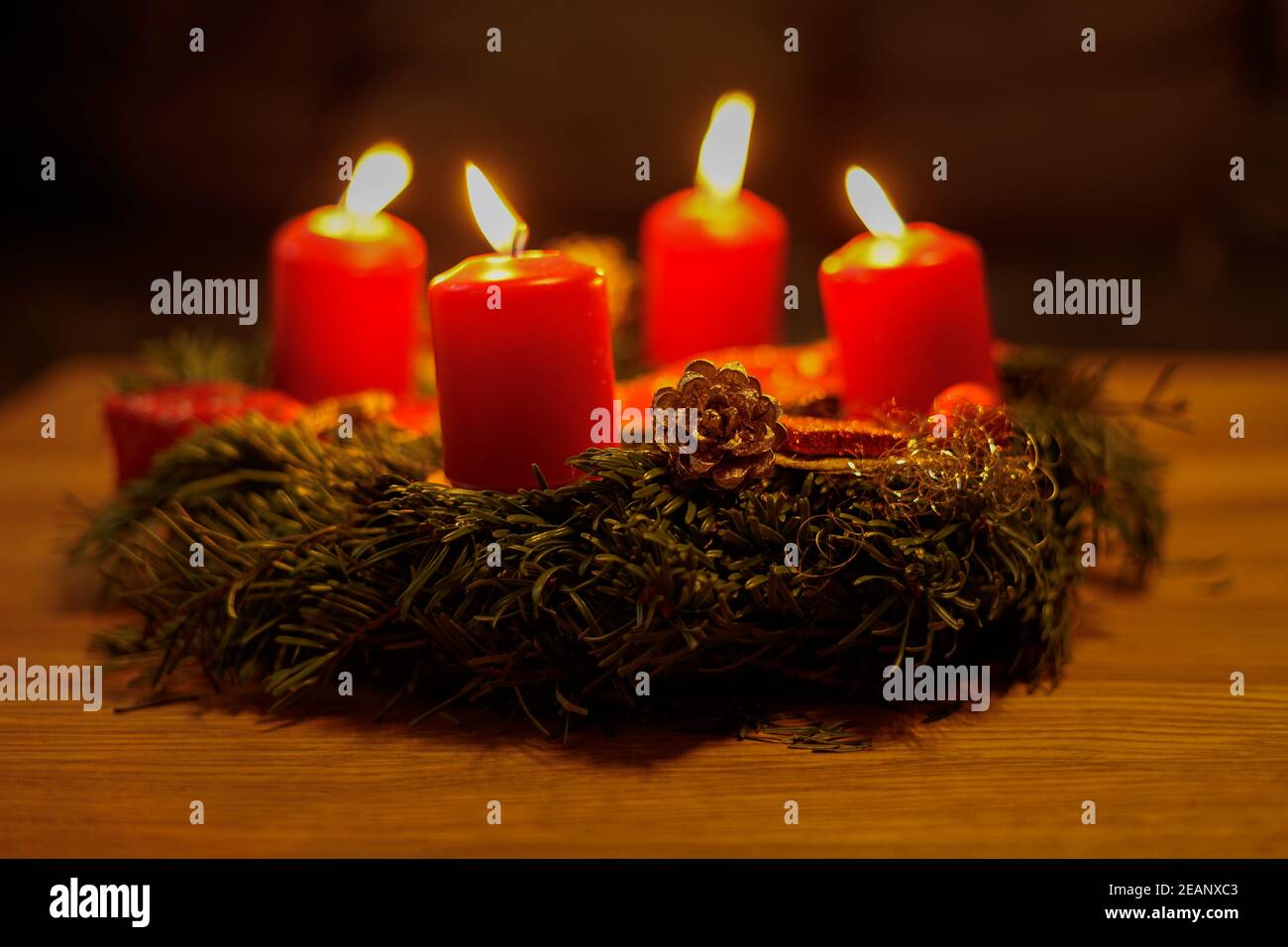 Candlelight with red candles on an advent wreath for christmas Stock