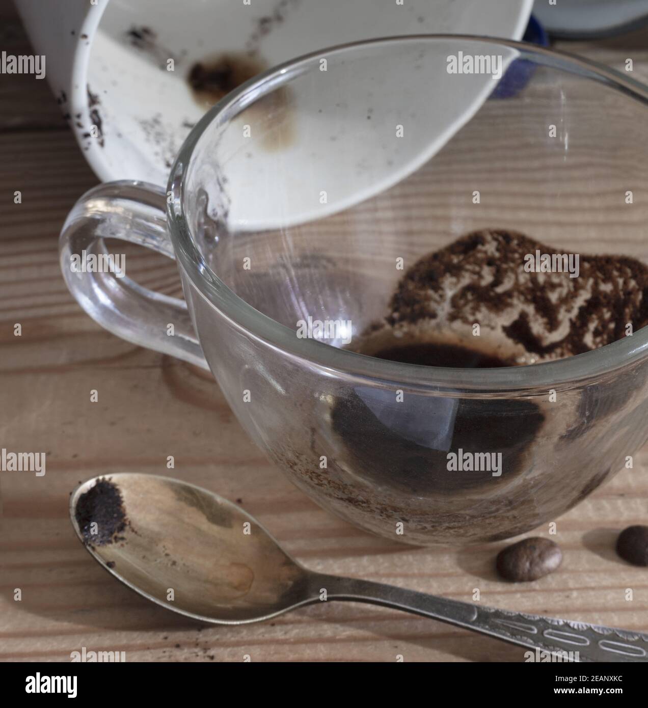 A dirty coffee Cup and saucer and a coffee mug Stock Photo Alamy