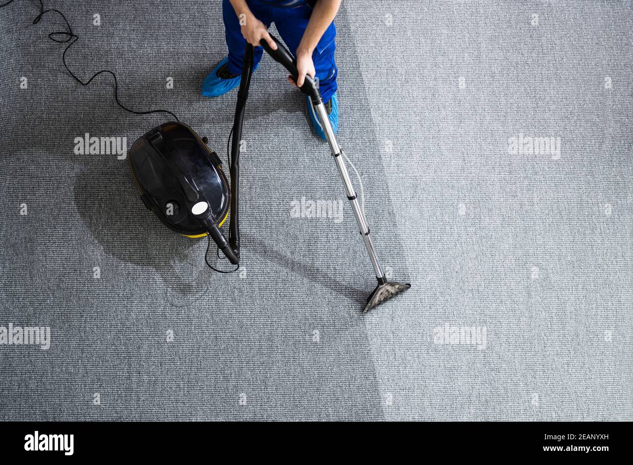 Janitor Cleaning Carpet With Vacuum Cleaner Stock Photo Alamy