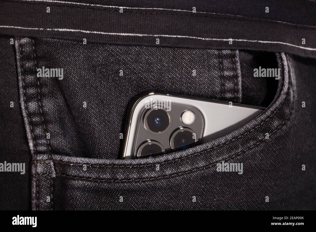 iPhone 12 Pro Max Graphite in pocket. Stock Photo