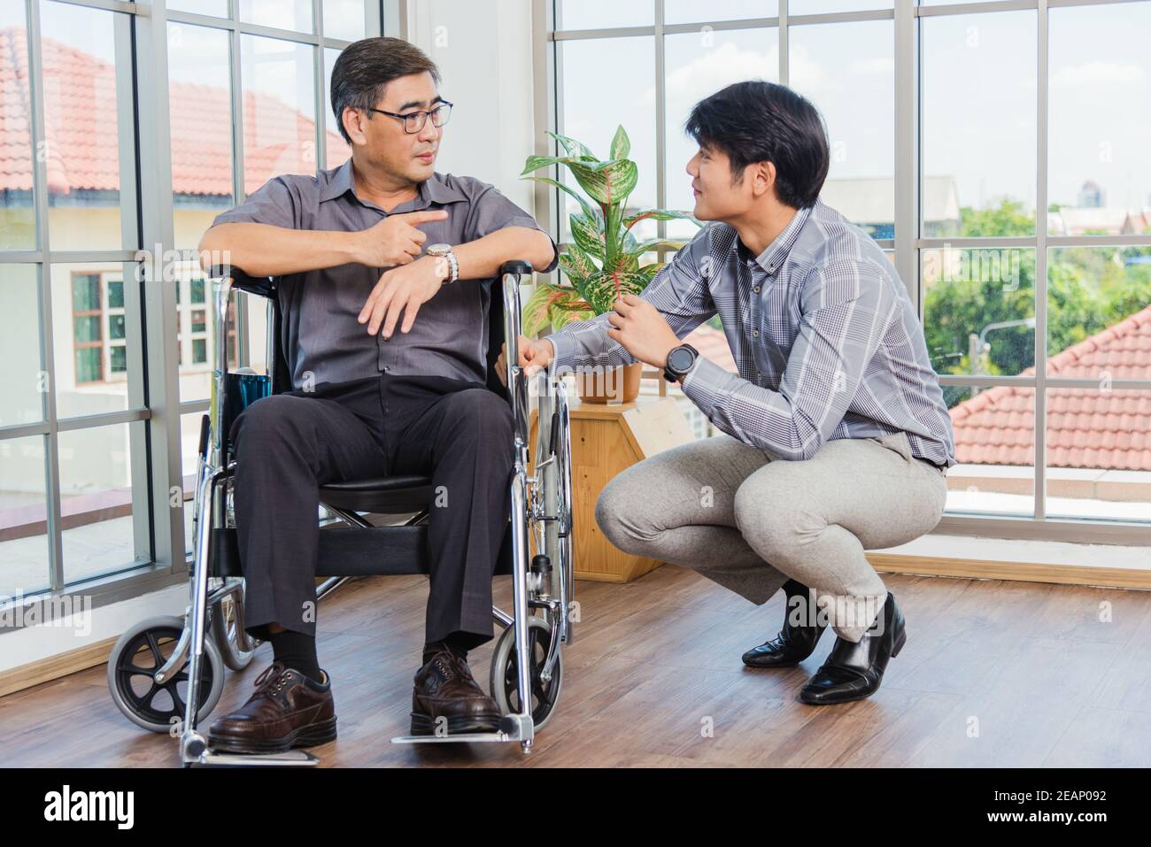 Old man in a wheelchair hi-res stock photography and images - Alamy