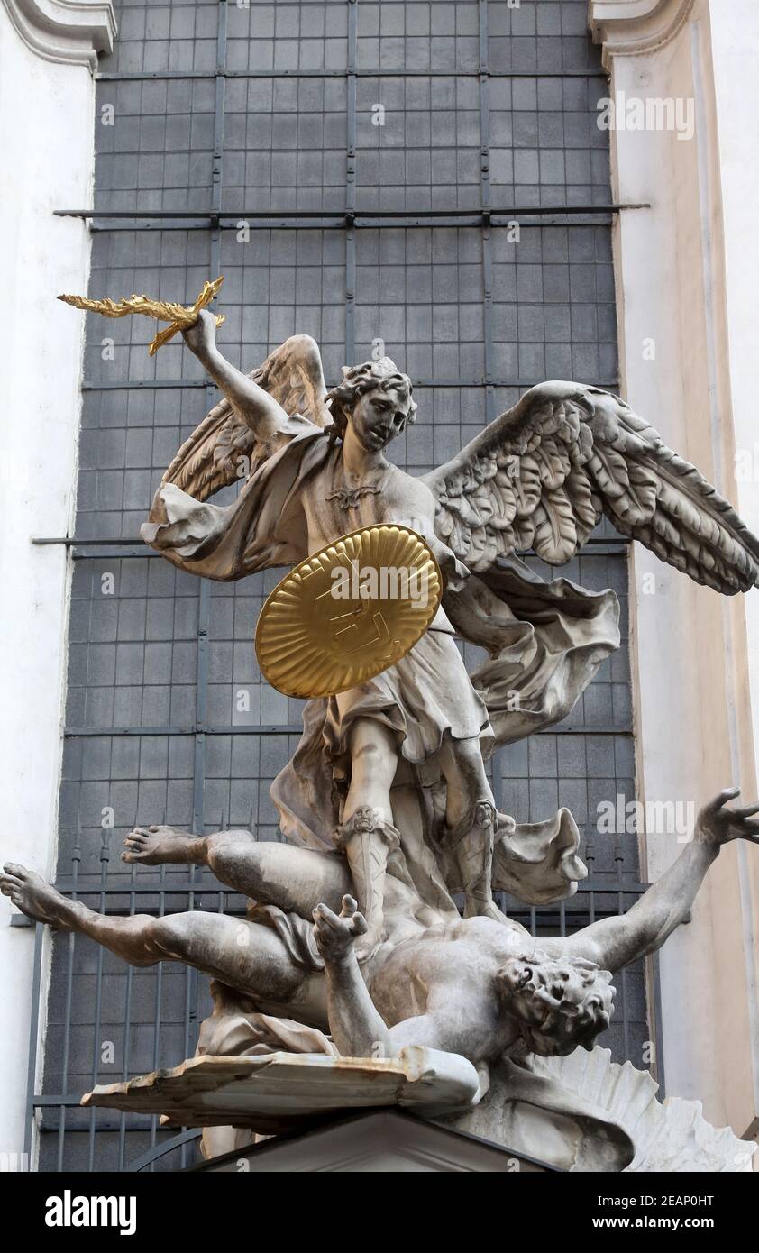 Statue of Saint Michael with gold shield and sword in center of Vienna ...