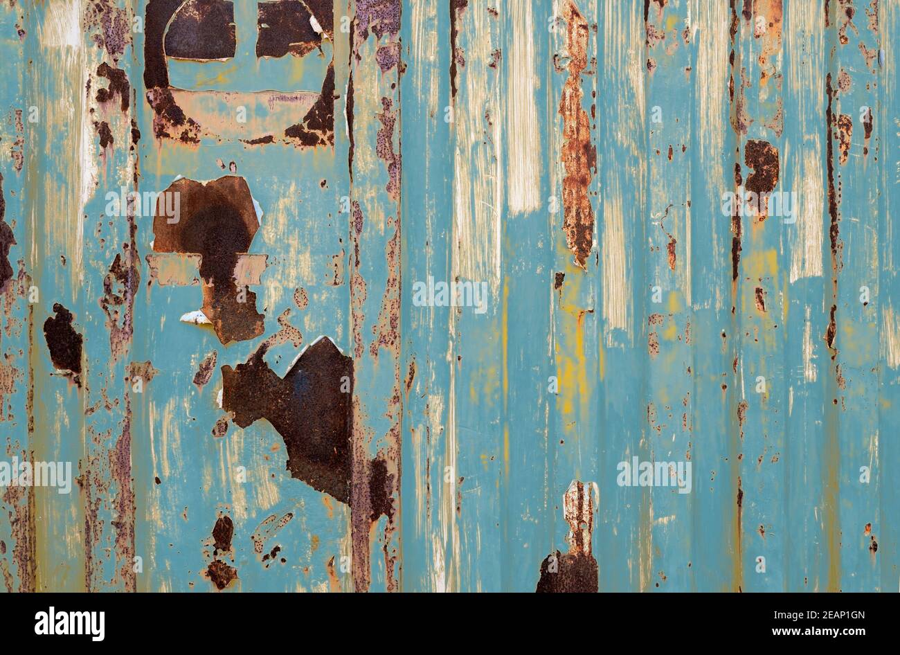 Old rusty metal painted with blue color. Empty blue wall texture  background. Peeling paint on blue striped wall. Rust and oxidized metal.  Closeup texture of old logistics container. Old iron panel Stock