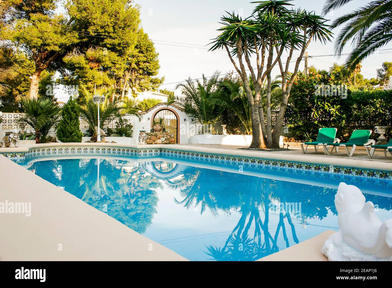 Classic Spanish villa in Moraira with a pool set in a mediterranean mature garden, Spain Stock Photo