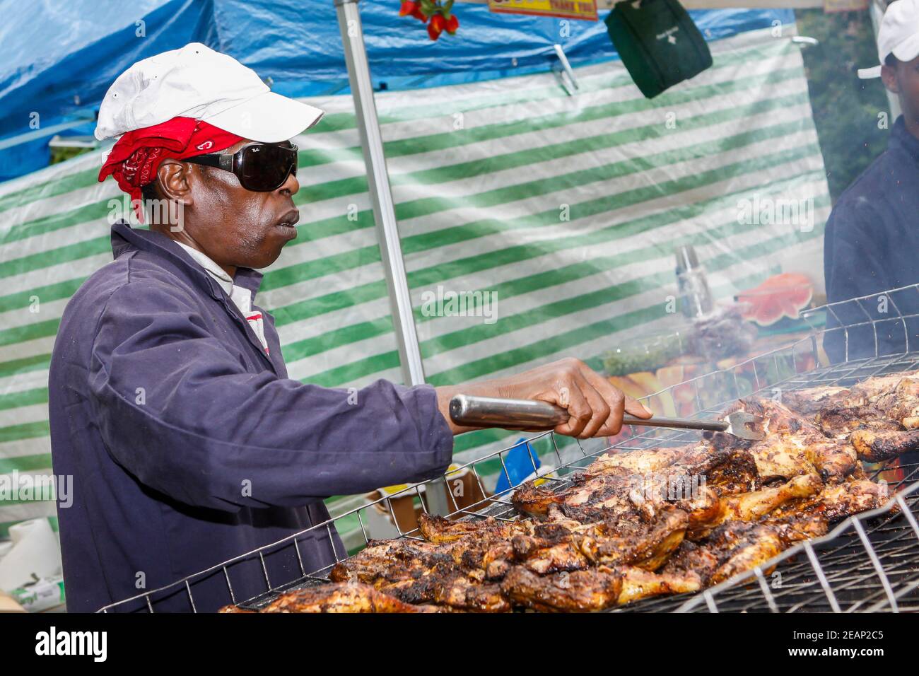 Jerk chicken at Jamaican food stall at Underground Festival in Crystal Palace,South London Stock Photo
