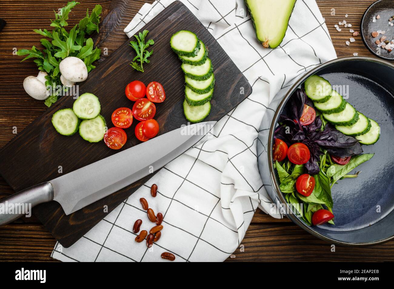 Fresh cutted vegetables, wooden background Stock Photo